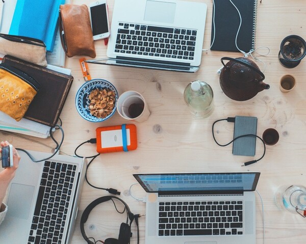Calm workspace with notebook, mug, and soft light